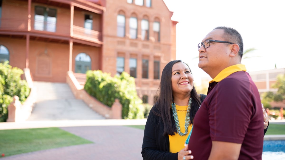 Parents standing outside building